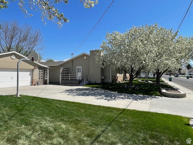 552 W 1200 N, Lehi, UT 84043 - view of front of home featuring stucco siding, driveway, a front lawn, and an attached garage