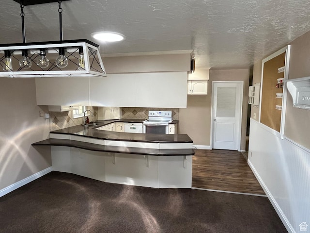552 W 1200 N, Lehi, UT 84043 - kitchen featuring white range with electric cooktop, a sink, dark countertops, baseboards, and a peninsula