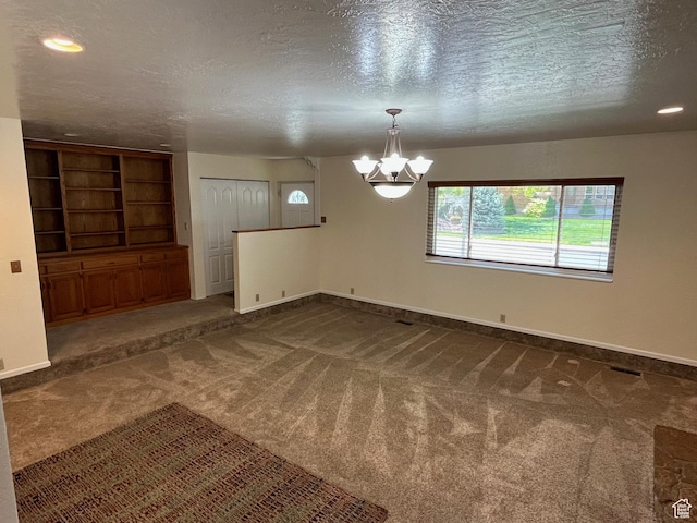 552 W 1200 N, Lehi, UT 84043 - unfurnished room featuring a chandelier, dark colored carpet, a textured ceiling, baseboards, and recessed lighting