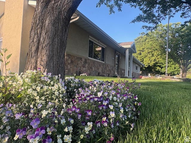 552 W 1200 N, Lehi, UT 84043 - view of side of property with stucco siding, stone siding, and a lawn