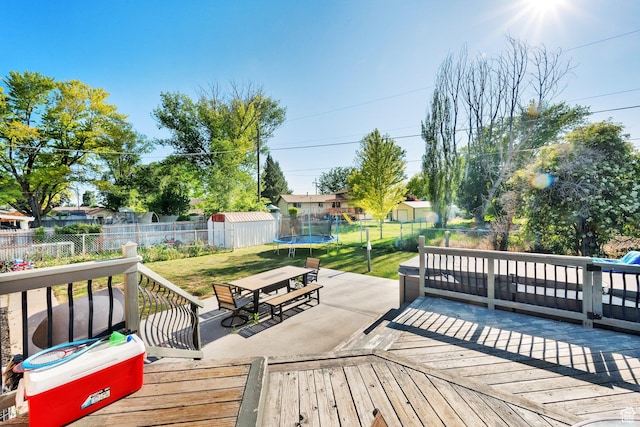 1657 N 1500 W, Clinton, UT 84015 - wooden terrace featuring a trampoline and a patio