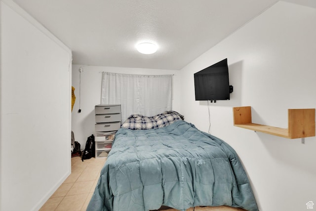 1657 N 1500 W, Clinton, UT 84015 - bedroom featuring tile patterned flooring, baseboards, and a textured ceiling
