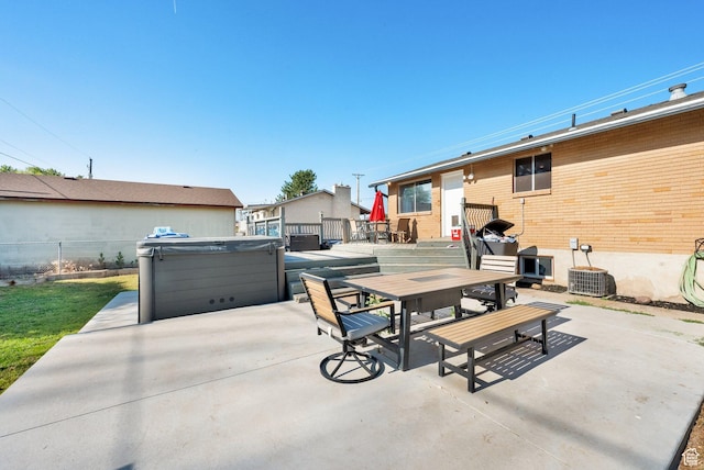 1657 N 1500 W, Clinton, UT 84015 - view of patio / terrace with a hot tub and outdoor dining space