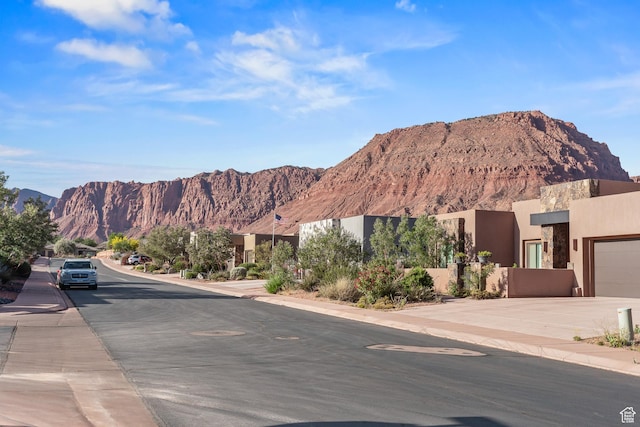 97 S 495 W, Ivins, UT 84738 - view of asphalt road featuring sidewalks, a mountain view, and curbs