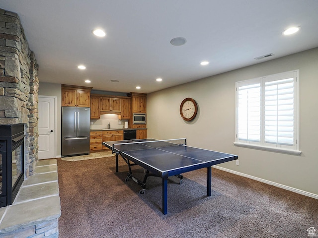 12687 S Verona Creek Way W, Riverton, UT 84065 - rec room featuring recessed lighting, a fireplace, and baseboards