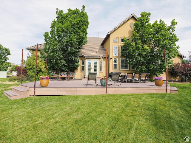 12687 S Verona Creek Way W, Riverton, UT 84065 - back of house with a deck, stucco siding, a yard, a tile roof, and outdoor dining area