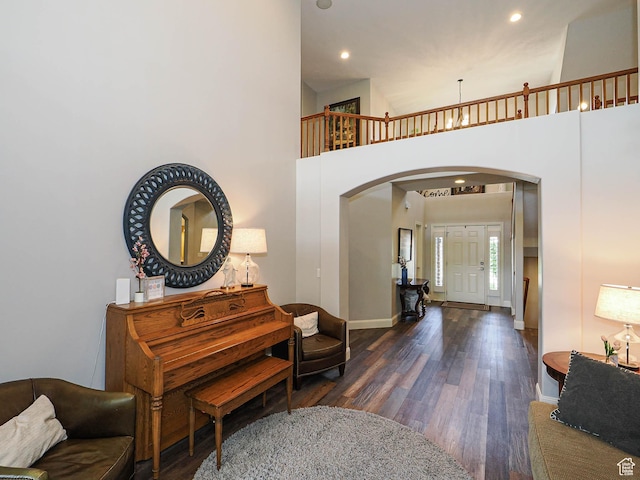 12687 S Verona Creek Way W, Riverton, UT 84065 - entrance foyer with arched walkways, dark wood-style flooring, baseboards, recessed lighting, and a high ceiling