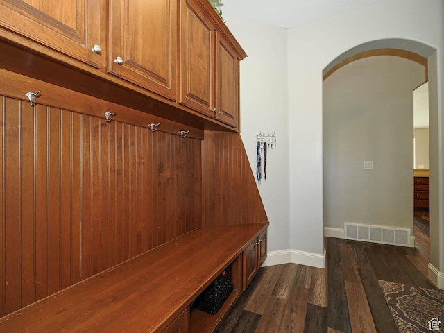 12687 S Verona Creek Way W, Riverton, UT 84065 - mudroom featuring arched walkways, dark wood-type flooring, and baseboards