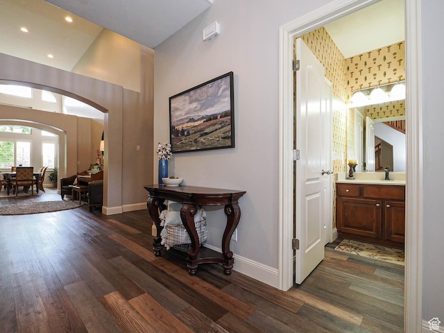 12687 S Verona Creek Way W, Riverton, UT 84065 - foyer featuring dark wood-style flooring, arched walkways, baseboards, and recessed lighting