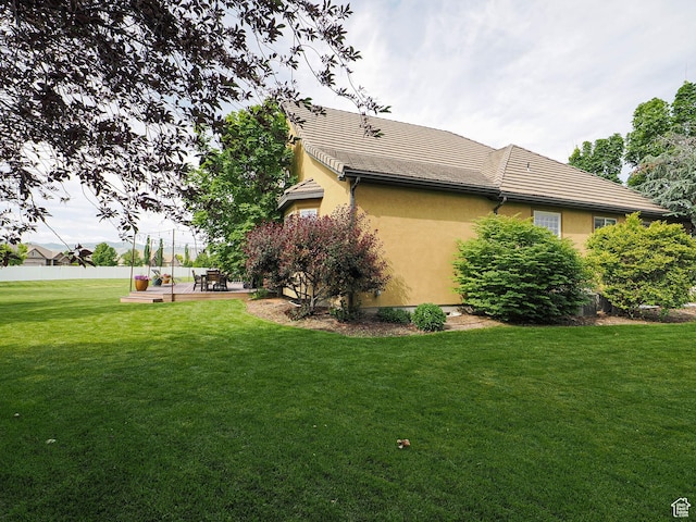 12687 S Verona Creek Way W, Riverton, UT 84065 - view of home's exterior with a patio, stucco siding, and a tiled roof