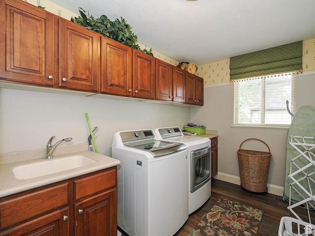 12687 S Verona Creek Way W, Riverton, UT 84065 - laundry room featuring cabinet space, washing machine and clothes dryer, wallpapered walls, dark wood-type flooring, and baseboards
