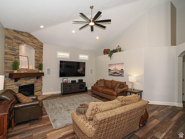 12687 S Verona Creek Way W, Riverton, UT 84065 - living room with ceiling fan, dark wood-type flooring, a stone fireplace, arched walkways, and baseboards