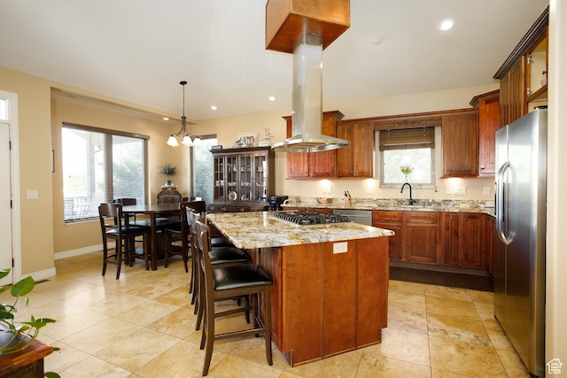 2073 S Allen Rd, Taylor, UT 84401 - kitchen with stainless steel appliances, island range hood, a sink, light stone countertops, and a center island