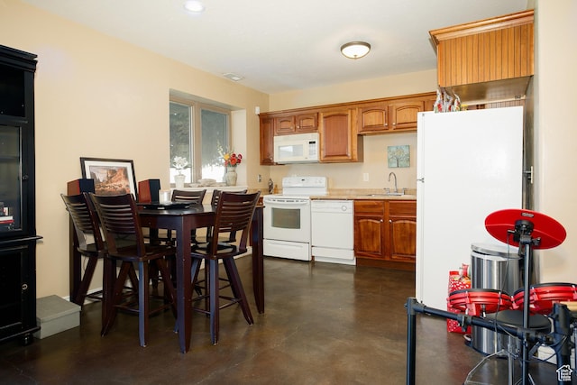 2073 S Allen Rd, Taylor, UT 84401 - kitchen featuring white appliances, a sink, finished concrete flooring, brown cabinetry, and recessed lighting
