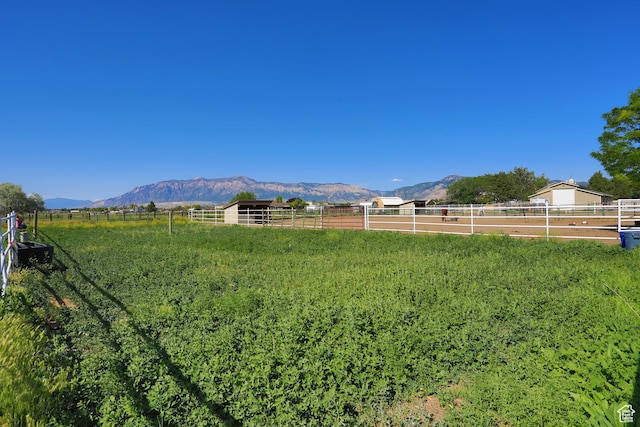 2073 S Allen Rd, Taylor, UT 84401 - view of yard with an outdoor riding arena, a mountain view, a view of rural / pastoral area, and an exterior structure
