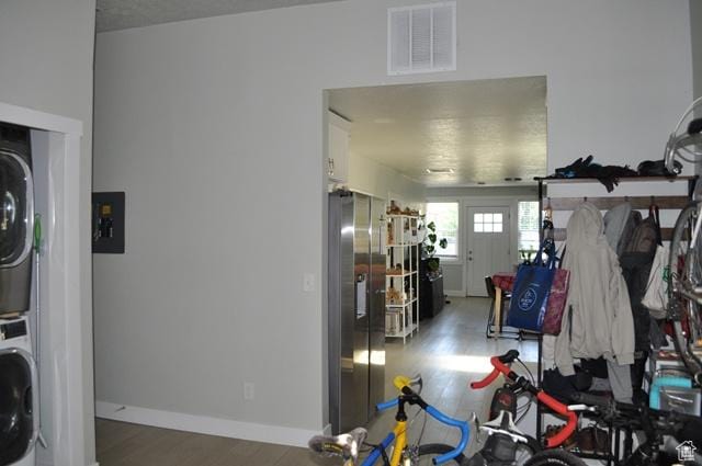 331 E Hampton Ave S, Salt Lake City, UT 84111 - laundry area featuring stacked washer / dryer, wood finished floors, and baseboards