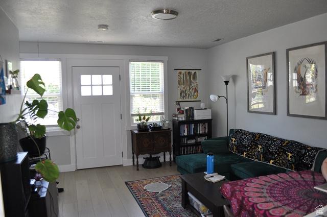 331 E Hampton Ave S, Salt Lake City, UT 84111 - living room featuring a textured ceiling and hardwood / wood-style flooring