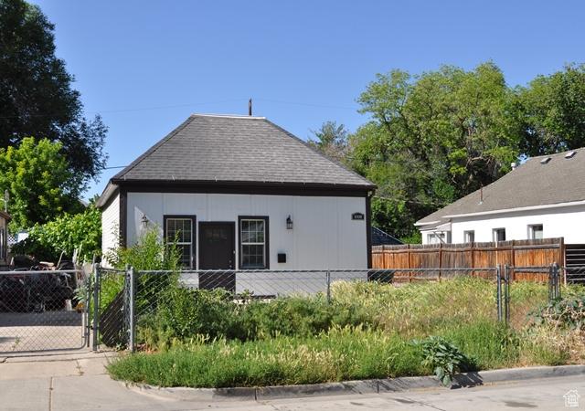 331 E Hampton Ave S, Salt Lake City, UT 84111 - rear view of house with a fenced front yard, a gate, and roof with shingles
