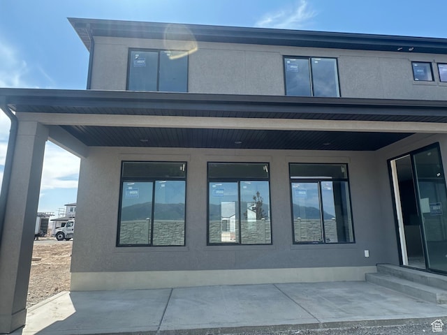3551 S 2410 W Unit 315, Syracuse, UT 84075 - rear view of house featuring stucco siding and entry steps