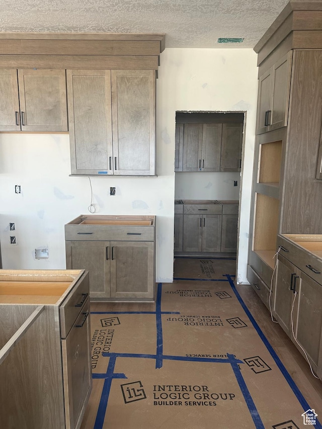 3551 S 2410 W Unit 315, Syracuse, UT 84075 - kitchen featuring a textured ceiling