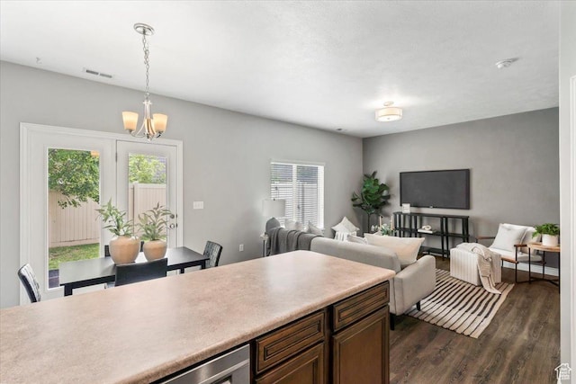 1853 W 2300 S, Woods Cross, UT 84087 - kitchen with plenty of natural light, dark wood finished floors, a chandelier, and pendant lighting
