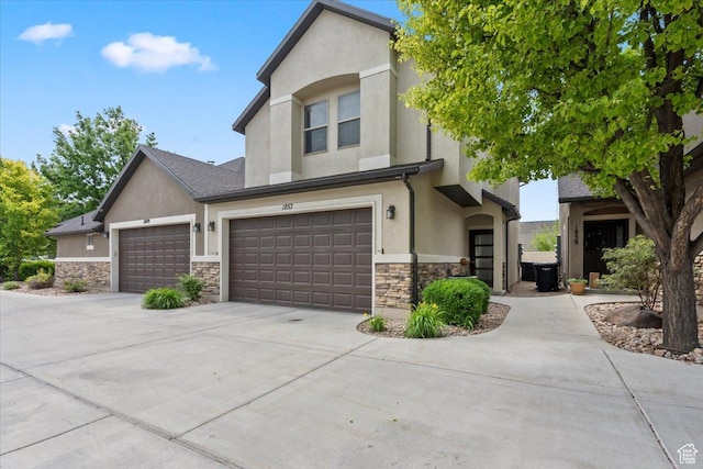 1853 W 2300 S, Woods Cross, UT 84087 - view of front of property with stone siding, stucco siding, and concrete driveway