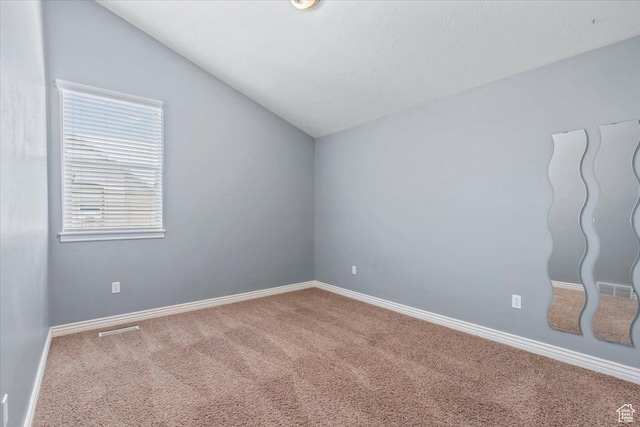 1853 W 2300 S, Woods Cross, UT 84087 - carpeted empty room featuring vaulted ceiling and baseboards
