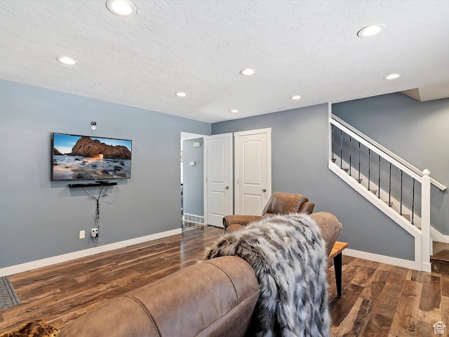 1631 E 1470 S Unit 5E, Ogden, UT 84404 - living room featuring wood finished floors, baseboards, recessed lighting, stairs, and a textured ceiling