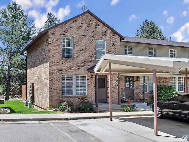 1631 E 1470 S Unit 5E, Ogden, UT 84404 - view of front of property with brick siding and covered and uncovered parking