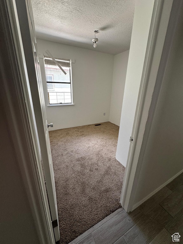 410 Rose Ave, Price, UT 84501 - carpeted empty room with a textured ceiling