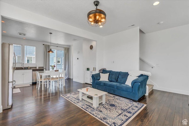 6202 W Birch Run Rd, South Jordan, UT 84009 - living area with baseboards, dark wood-type flooring, and recessed lighting