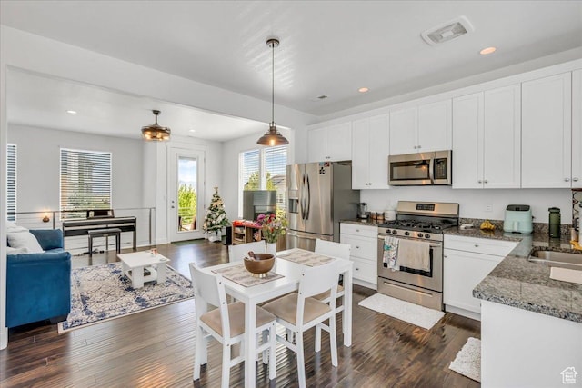 6202 W Birch Run Rd, South Jordan, UT 84009 - kitchen featuring appliances with stainless steel finishes, dark wood-style floors, white cabinets, and recessed lighting