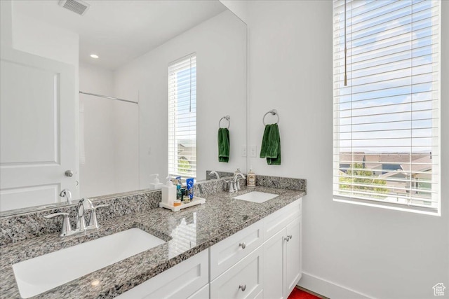 6202 W Birch Run Rd, South Jordan, UT 84009 - bathroom featuring double vanity and baseboards