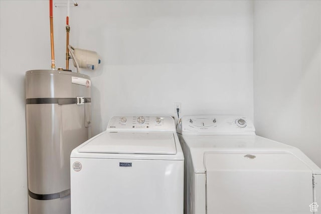 6202 W Birch Run Rd, South Jordan, UT 84009 - laundry area with washing machine and clothes dryer and strapped water heater