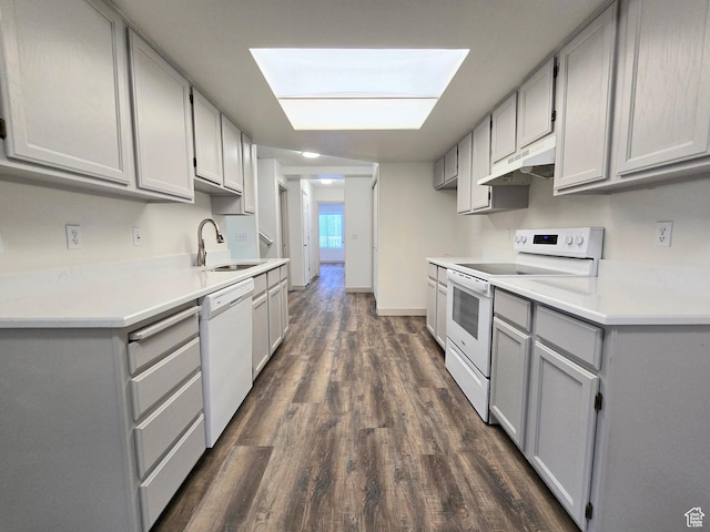 82 S Santa Rita Pl, West Jordan, UT 84088 - kitchen with white appliances, gray cabinetry, under cabinet range hood, a sink, and dark wood-type flooring