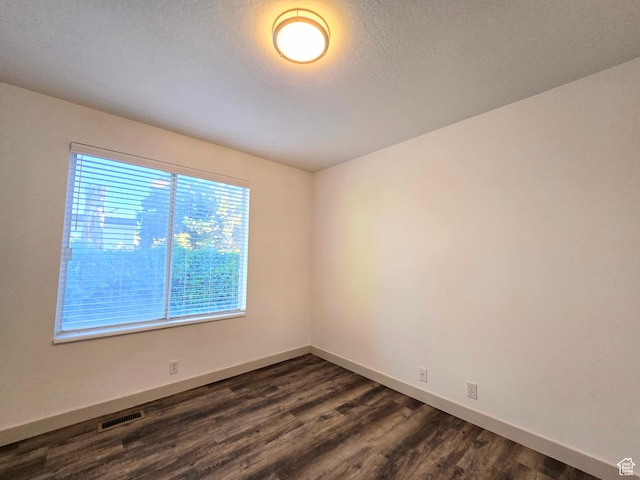 82 S Santa Rita Pl, West Jordan, UT 84088 - spare room with dark wood-type flooring and baseboards