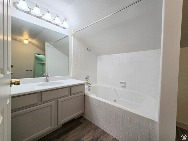 82 S Santa Rita Pl, West Jordan, UT 84088 - full bath featuring wood finished floors, lofted ceiling, vanity, and a combined bath / shower with jetted tub