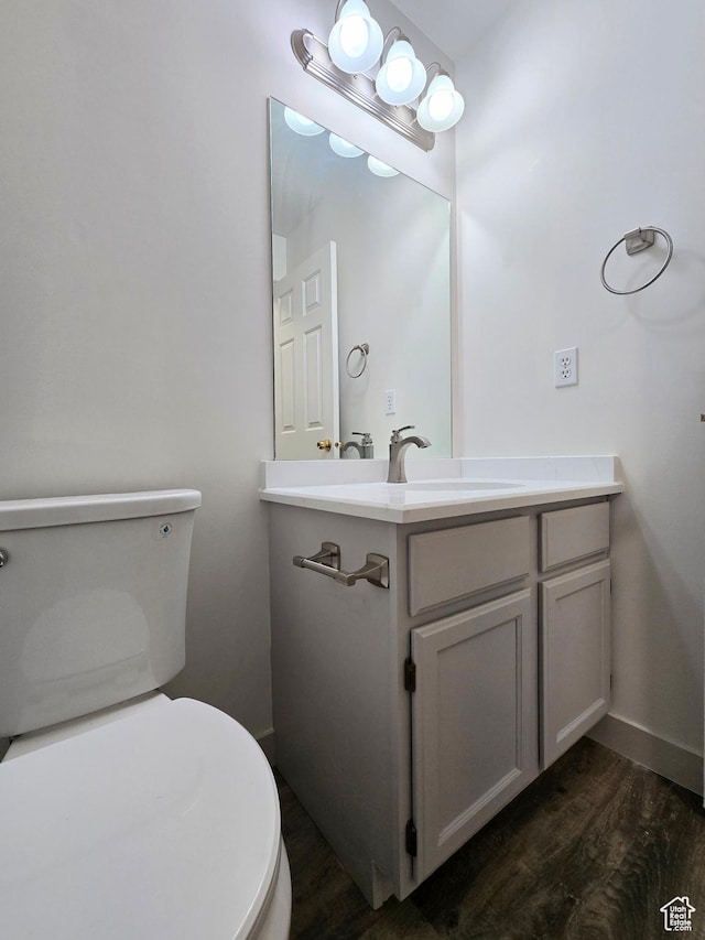 82 S Santa Rita Pl, West Jordan, UT 84088 - half bathroom featuring toilet, wood finished floors, vanity, and baseboards