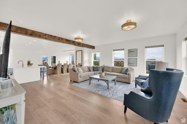 10777 S Lamond Dr W, South Jordan, UT 84009 - living area featuring light wood-type flooring, beamed ceiling, and recessed lighting