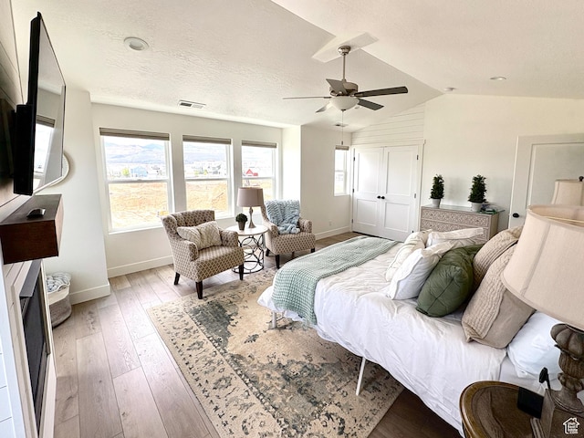 10777 S Lamond Dr W, South Jordan, UT 84009 - bedroom with baseboards, light wood-type flooring, vaulted ceiling, and ceiling fan