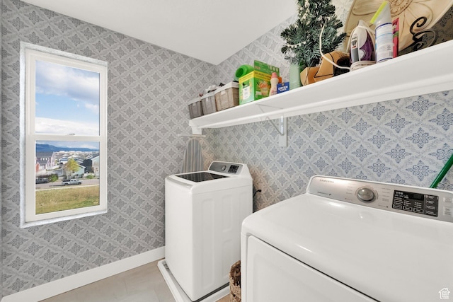 10777 S Lamond Dr W, South Jordan, UT 84009 - washroom with separate washer and dryer, baseboards, and light tile patterned flooring
