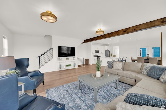 10777 S Lamond Dr W, South Jordan, UT 84009 - living area featuring wood finished floors, beamed ceiling, stairs, and recessed lighting
