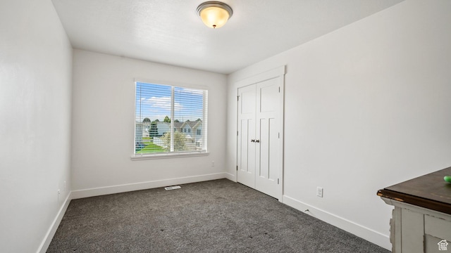 521 W 1110 N Unit Hc4, Logan, UT 84341 - unfurnished bedroom with carpet floors, baseboards, and a closet