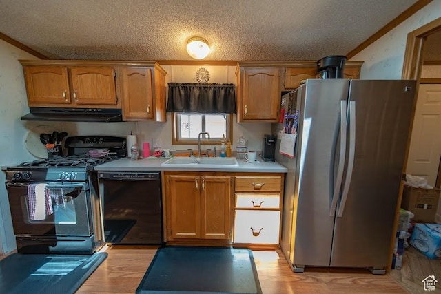 1700 W 2250 N, Helper, UT 84526 - kitchen with black appliances, a sink, ventilation hood, a textured ceiling, and light wood finished floors