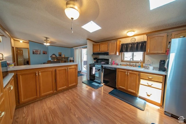 1700 W 2250 N, Helper, UT 84526 - kitchen featuring black appliances, a sink, a textured ceiling, under cabinet range hood, and light wood-style flooring