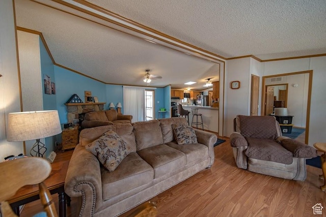 1700 W 2250 N, Helper, UT 84526 - living room featuring ornamental molding, a textured ceiling, light wood finished floors, and a ceiling fan