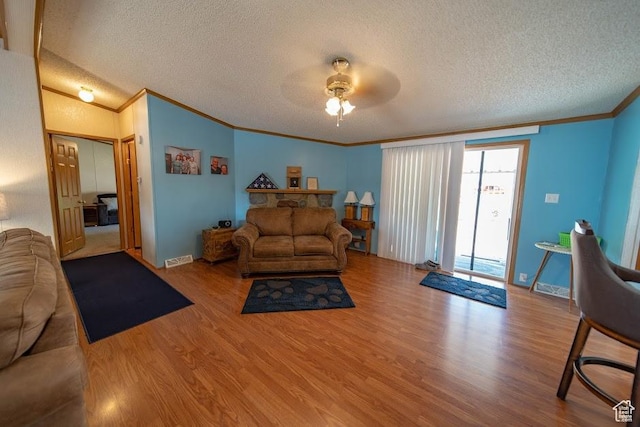 1700 W 2250 N, Helper, UT 84526 - living room with ornamental molding, a textured ceiling, wood finished floors, ceiling fan, and baseboards