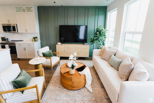 866 S 320 E Unit 168, Spanish Fork, UT 84660 - living area featuring healthy amount of natural light and wood finished floors