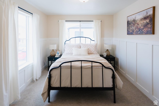 866 S 320 E Unit 168, Spanish Fork, UT 84660 - carpeted bedroom featuring a decorative wall and a wainscoted wall