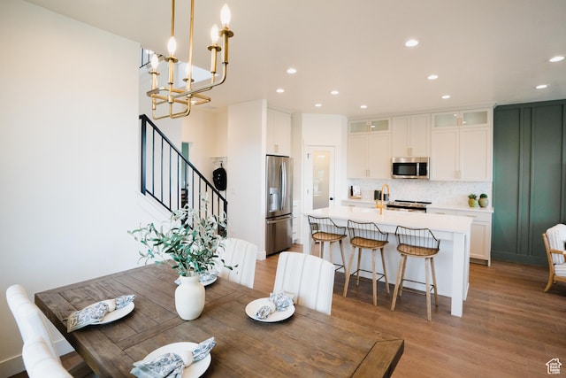 866 S 320 E Unit 168, Spanish Fork, UT 84660 - dining room with recessed lighting, light wood-style floors, a chandelier, and stairs